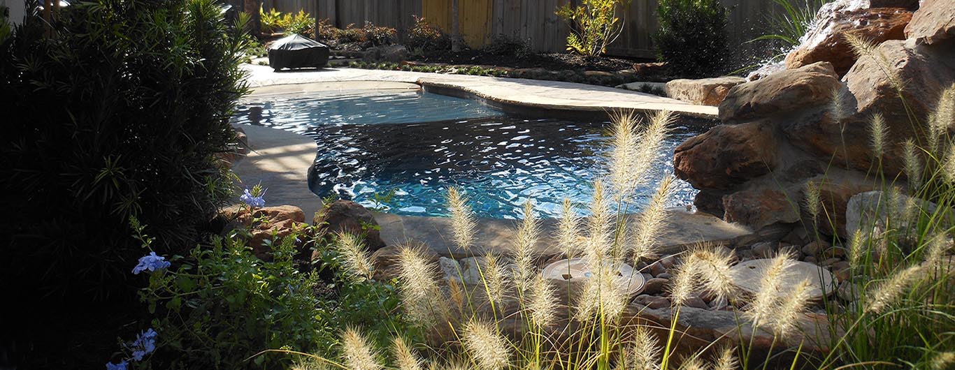 Waterfalls, ponds, creekbeds, rocks, urns, waterscapes, YardBirds Landscape Design and Installation Services.